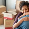 Young,African,Woman,Holding,Home,Keys,While,Hugging,Boyfriend,In