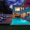 Modern,Villa,With,Colored,Led,Lights,At,Night.,Nobody,Inside