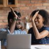 Happy,Excited,Black,Mixed,Race,Couple,Celebrating,Financial,Success,At