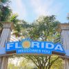"florida,Welcomes,You",Sign,Against,Palm,Trees,And,Blue,Sky