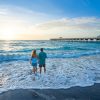 People,Walking,On,The,Beach.,Couple,Holding,Hands,Standing,On