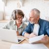 Busy,Caucasian,Old,Elderly,Senior,Couple,Making,Calculations,At,Home